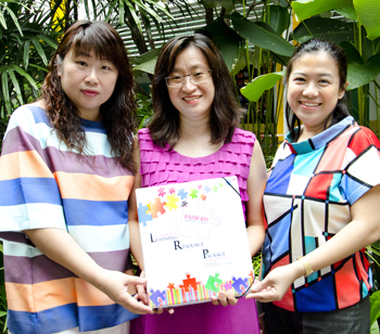 (From left) Jalene, Dawn and Indriana with the Science Assessment for Learning (AfL) package they developed. It contains a variety of AfL tools that teachers can readily use in the classroom.